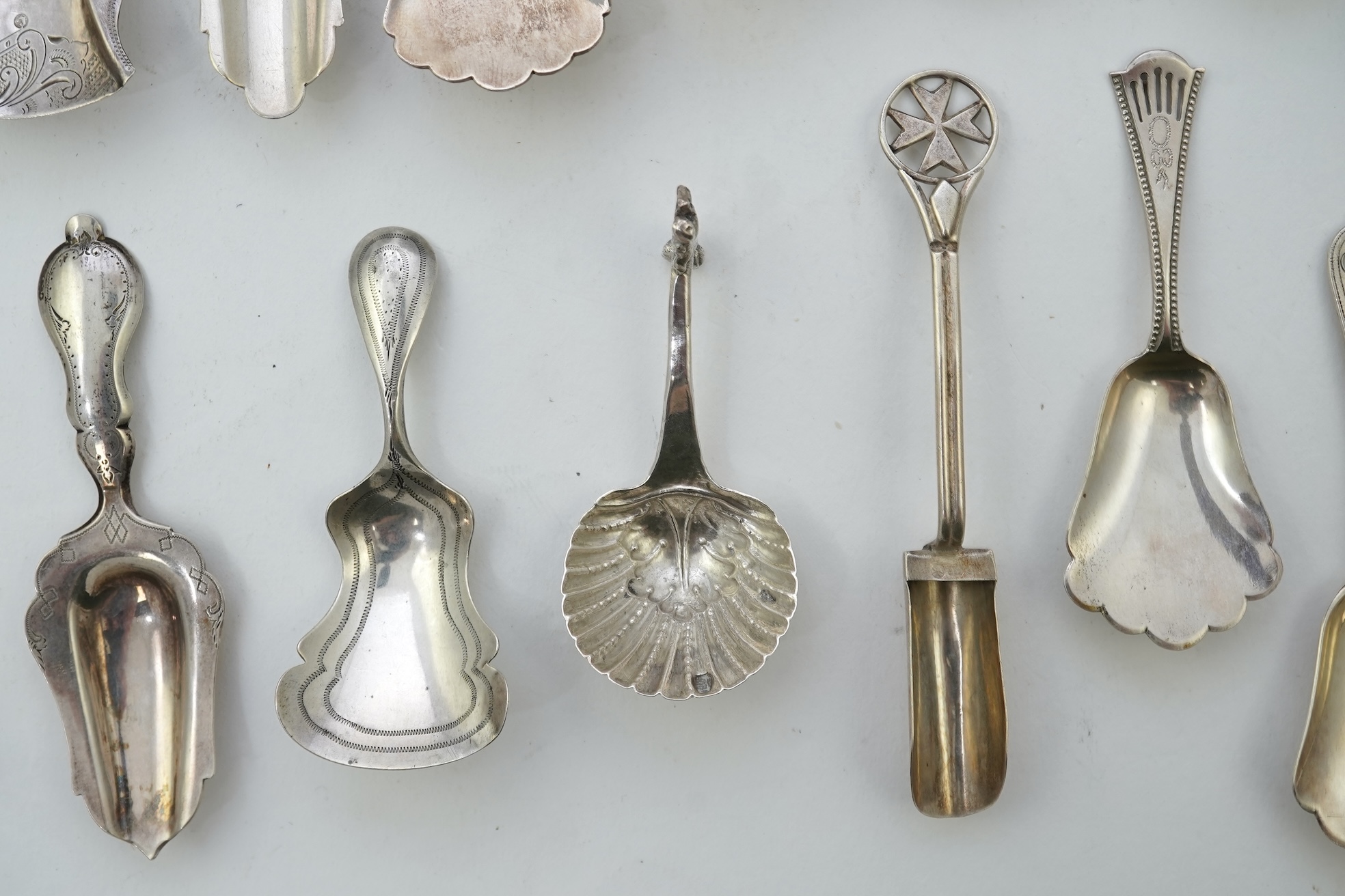 A collection of seventeen mainly 19th century Dutch white metal caddy spoons